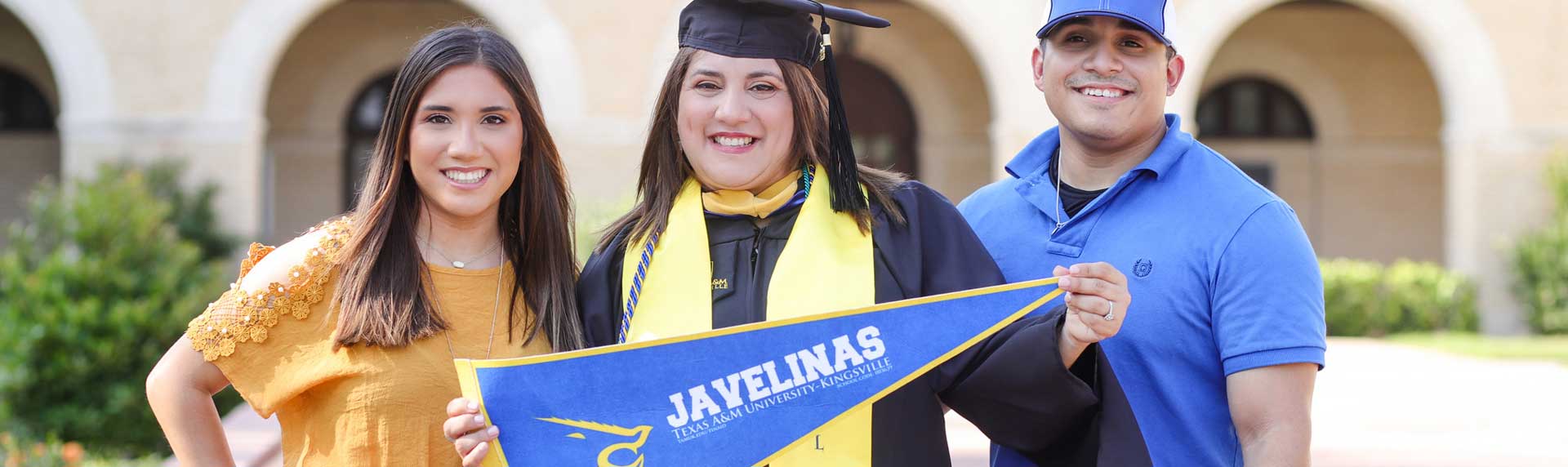 Graduate student posing for photo with her family