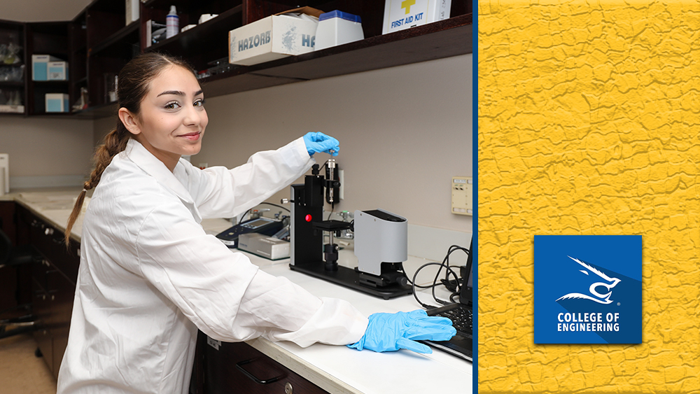 Kristin Treviño, a student in a white lab coat and blue gloves, smiles while working with lab equipment in an environmental engineering research lab at Texas A&M University–Kingsville.