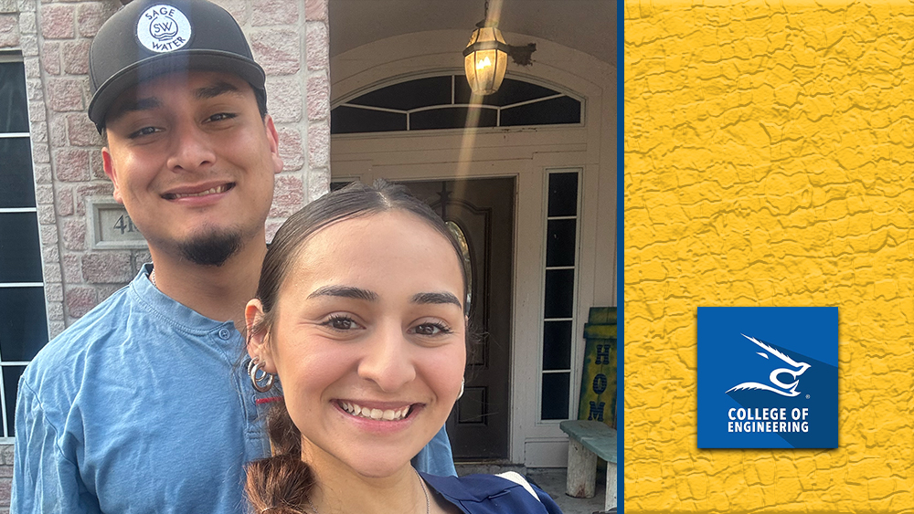 Noah Barrientez, a mechanical engineering student at the Frank H. Dotterweich College of Engineering, smiles alongside his girlfriend, Ariel Ramon, in front of a brick home. He is wearing a Sage Water cap, reflecting his summer internship experience with the company.