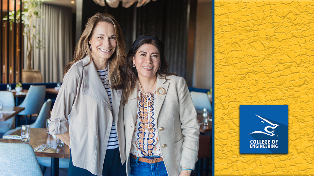 Dean Heidi A. Taboada stands beside Catherine Savage in a restaurant setting.