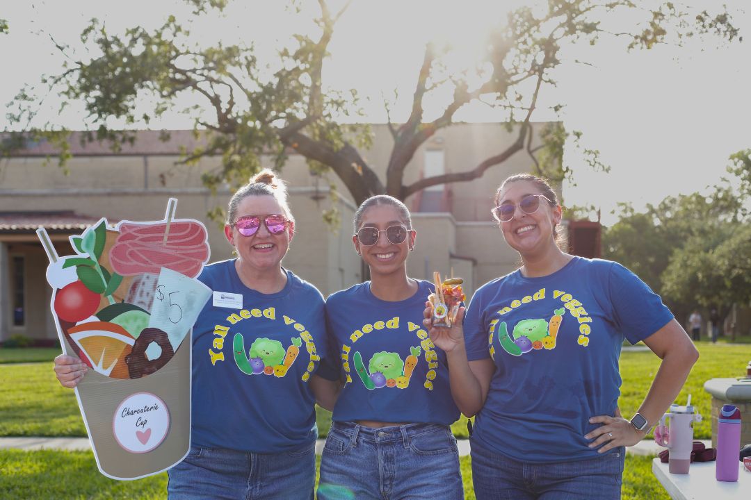 Students at the TAMUK Spring Fling selling charcuterie cups. 