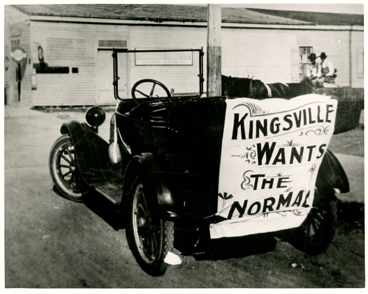 Model T Ford with banner that reads "Kingsville Wants The Normal!"