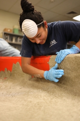 ASCE students working on the concrete canoe.