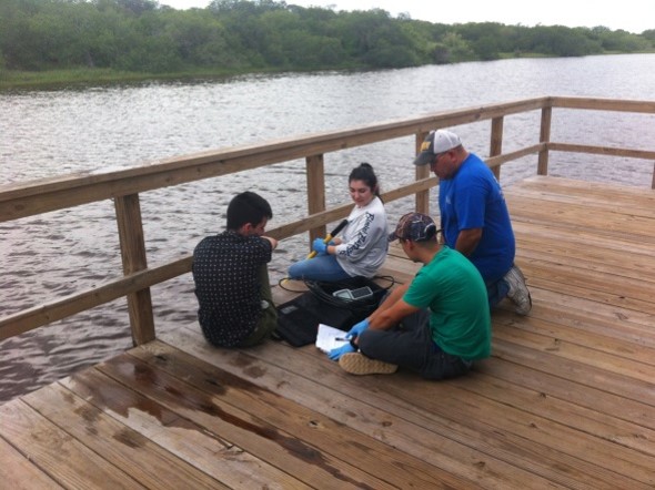 Environmental Engineering Students Collecting Samples at a Dock Picture1