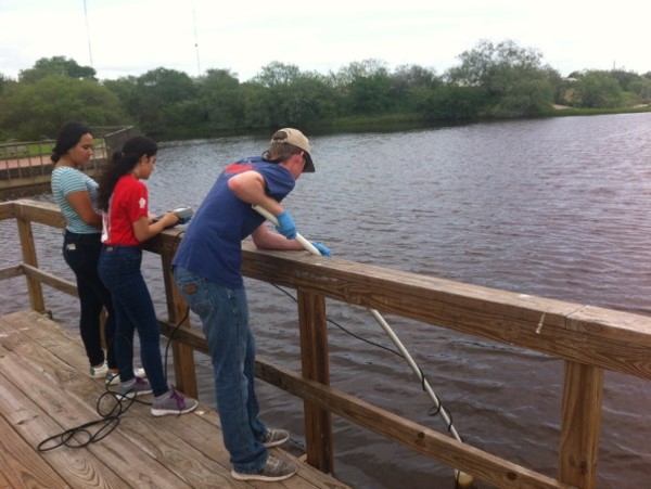 Environmental Engineering Students Collecting Samples at a Dock Picture2