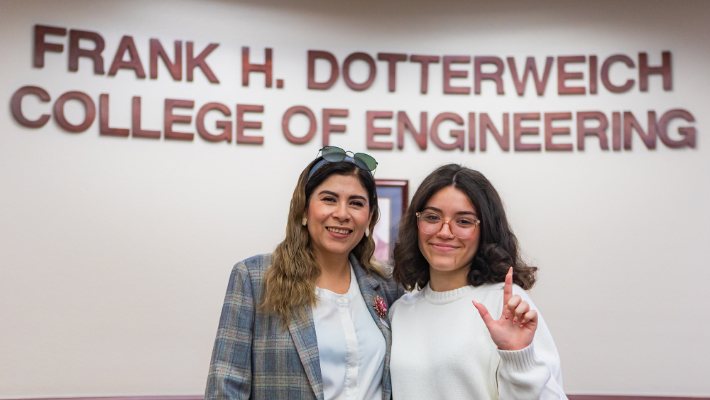 Dr. Heidi A. Taboada and Glenda L. Villagran. In the background, words read: Frank H. Dotterweich College of Engineering. Photo by Jesus A. Reina