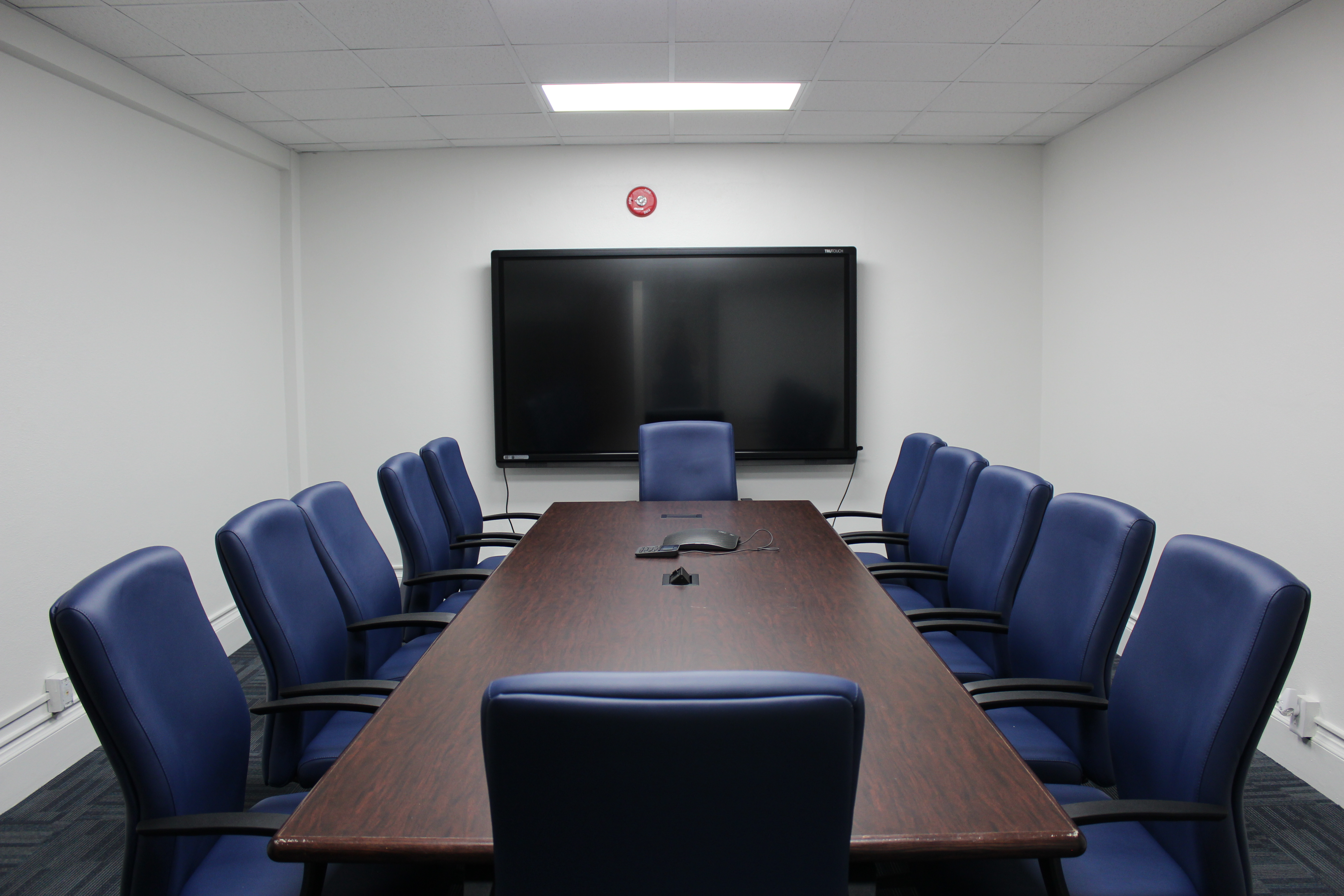 MSUB 211 is a 12-person conference room with a wall mounted touch screen display.
