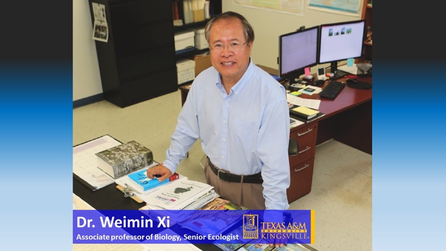 Dr.Weimin-Xi posing next to various publications