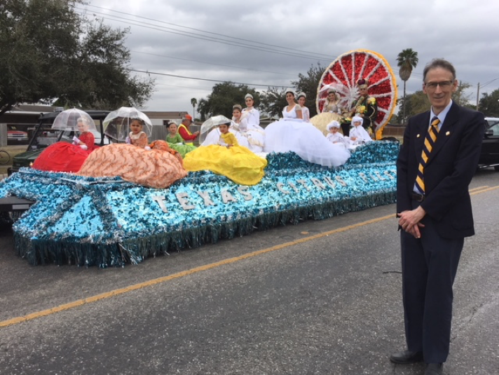 Dr. John da Graca, Director of the Citrus Center and appointed Grand Marshall of the Parade of Oranges poses by the royal float.