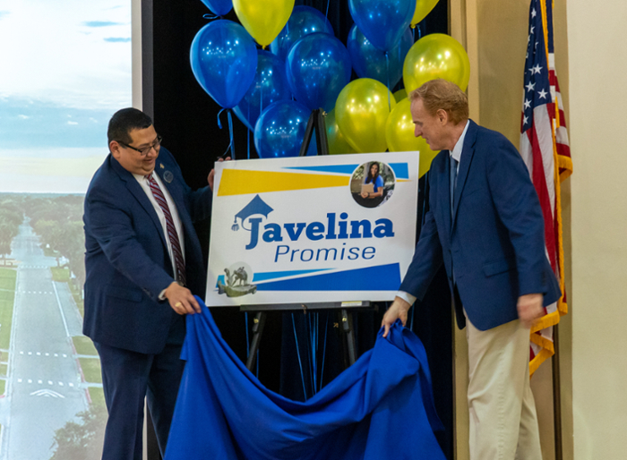 Dr. Rito Silva (left), Vice President of Enrollment Services and Student Affairs, and Dr. Darin Hoskisson (right), Assistant Vice President for Enrollment Management, unveil the logo for Javelina promise, the new tuition assistance program from Texas A&M University-Kingsville.   