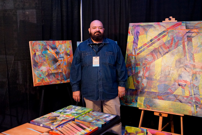 De la Rosa poses with artwork