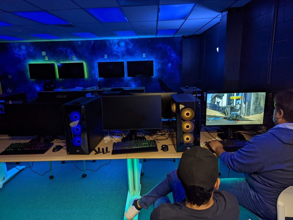 Gamer sits at a new computer testing out Halo.